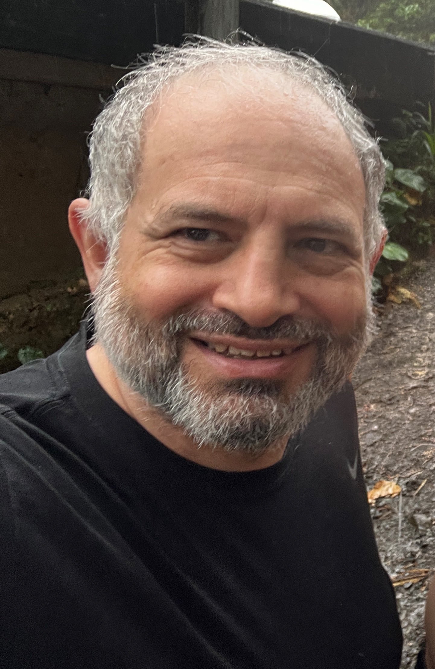 Gemal Seede smiling outdoors.